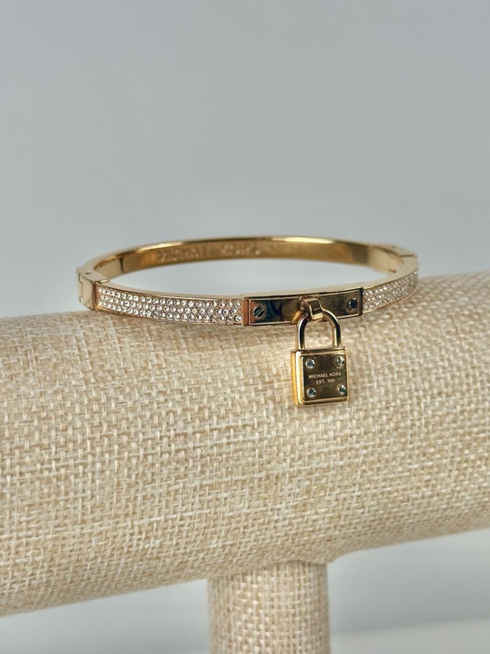 Michael Kors Brilliance Gold Plated Crystal Hinged Bracelet, Logo Pad Lock Charm